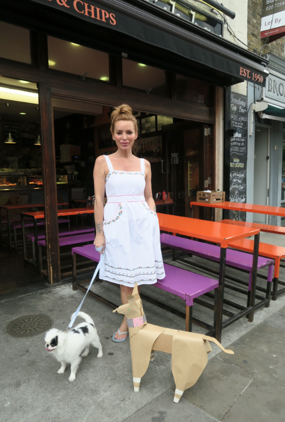 Fashionable lady in white with Tokyo Dog and a real dog in Broadway Market. Picture taken by Akane Takayama.